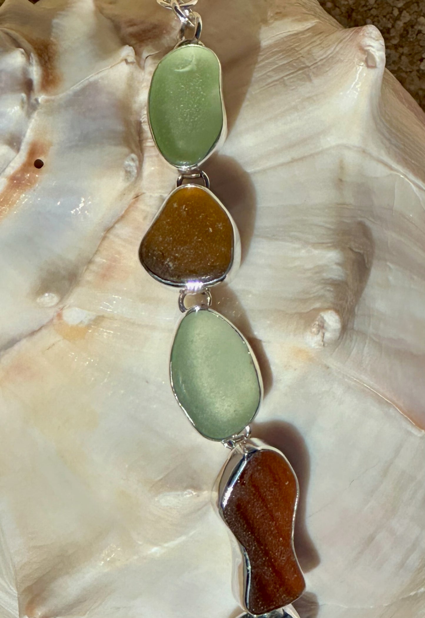 sea foam, amber, and brown sea glass fish and shell bracelet