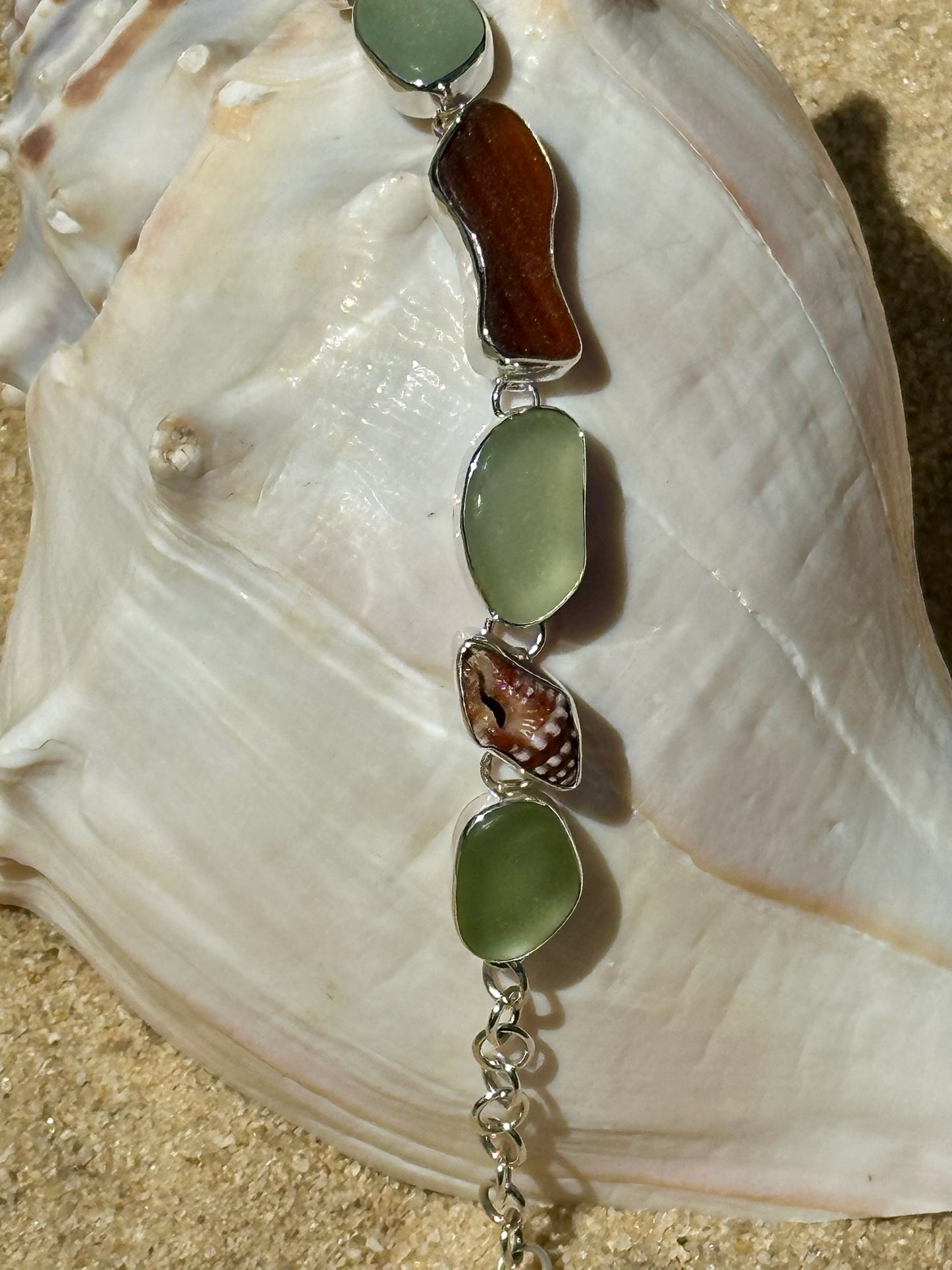 sea foam, amber, and brown sea glass fish and shell bracelet