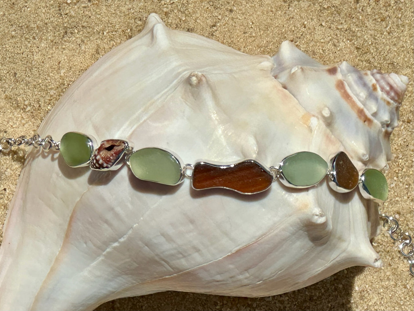 sea foam, amber, and brown sea glass fish and shell bracelet
