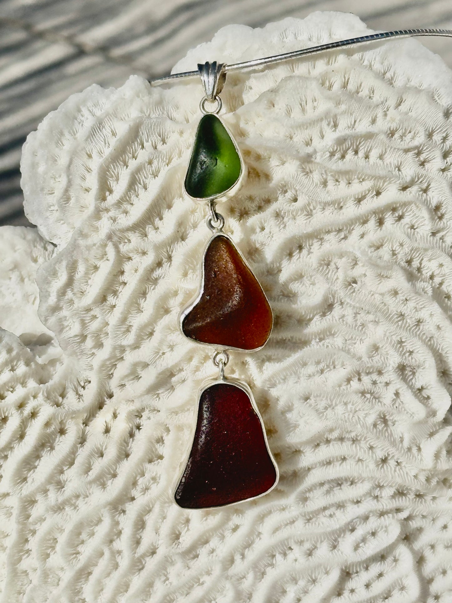 red, amber, and green sea glass pendant