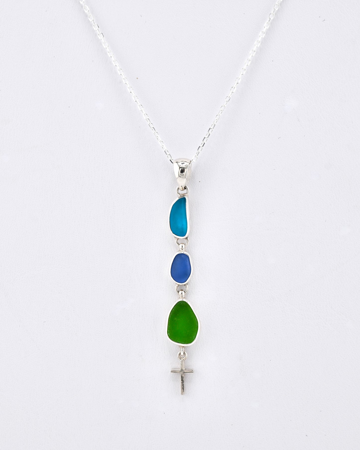 turquoise, blue, and green sea glass cross pendant