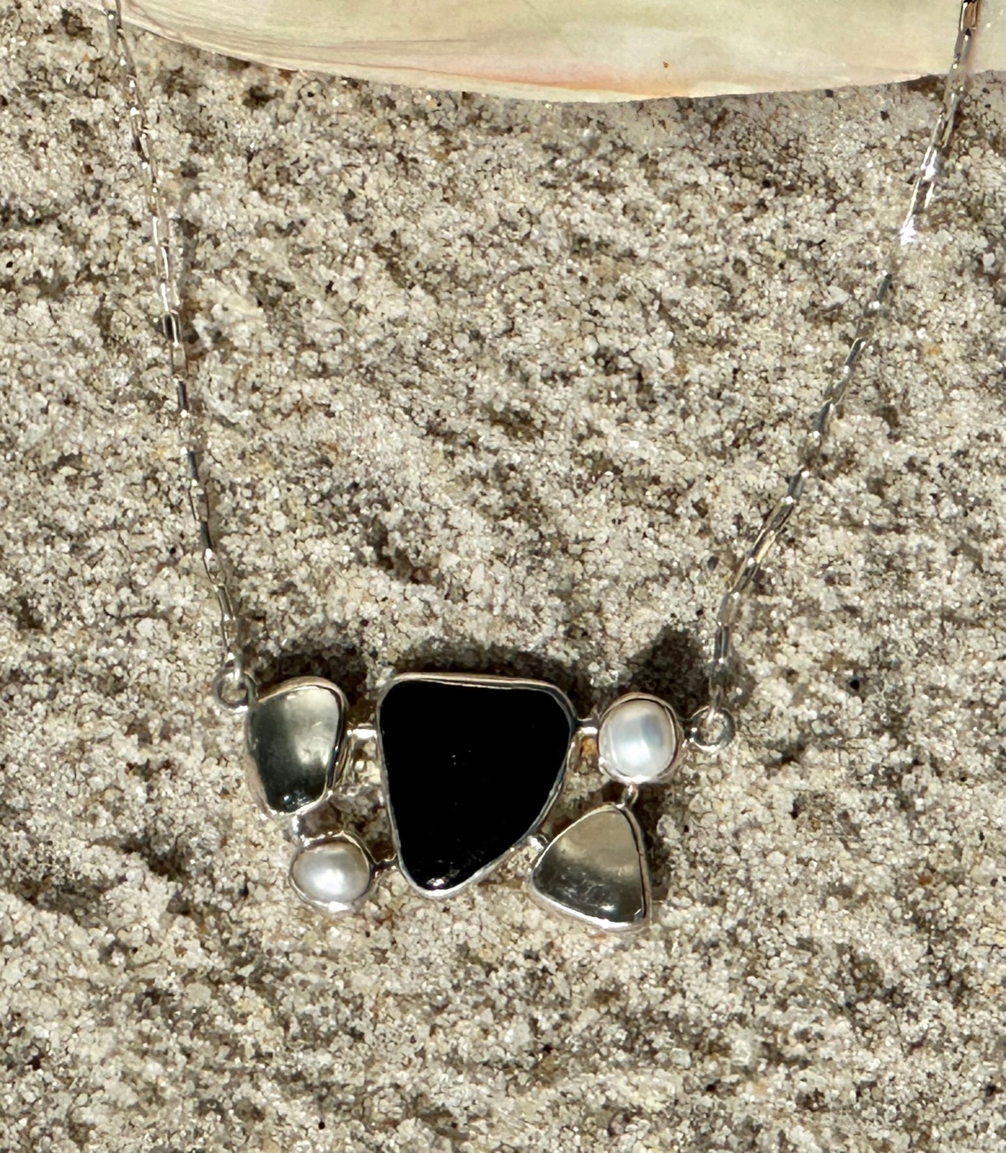black and gray sea glass pendant necklace with pearls